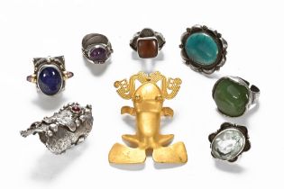 An antique collection of Tibetan silver and coloured metal and other rings and jewellery.