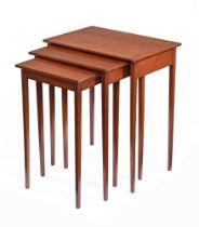 An Edwardian mahogany nest of trio tables, with rectangular line inlay tops on slender tapered legs.