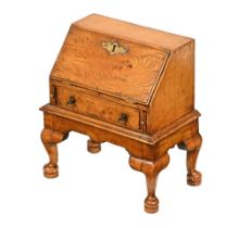 A miniature oak tabletop bureau in the 18th century style, with fitted interior,