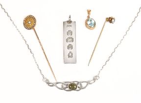 A 9 ct gold pendant with aquamarine and rope twist edge, together with a seed pearl set stick pin,