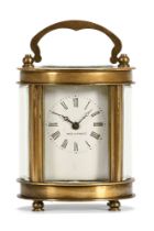A brass French carriage clock of small form, oval in plan, timepiece only.