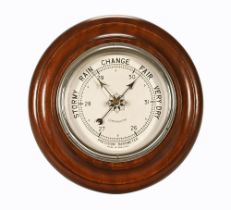 A 20th century circular wall barometer "Precision Barometer Made in England".