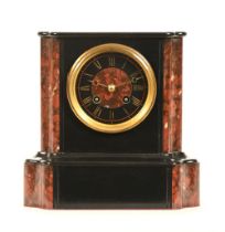 An early 20th century polished marble and black slate mantel clock, 22 cm high.