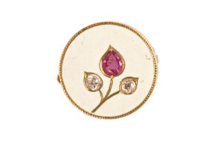 A gold coloured metal ruby and diamond set enamelled brooch, with safety chain, diameter 19.