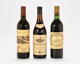 A collection of three bottles of red wine, comprising Domain de Chevalier 1979,