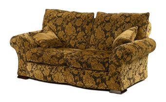 A gold and black flora upholstered two seater settee,