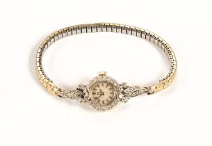 A 14 ct gold Omega ladies diamond set cocktail watch, with later expanding bracelet.