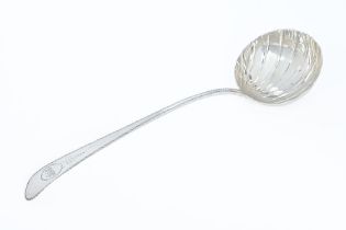 A George III silver Dublin silver soup ladle by John Kelly 1783, pointed end, bright cut handle,