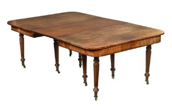 A William IV mahogany dining table, in two sections with central leaf,