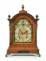 A late Victorian oak frame mantel clock,