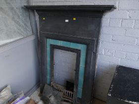 Metal fire surround with green tile inlay