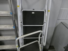 Two pairs of step ladders one with hand rails