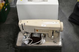 Electric Singer sewing machine in case
