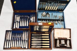 Four cased sets of cutlery