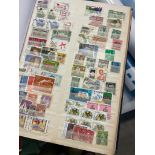 Stamps, a large worldwide stamp album comprising used and unused issues dating throughout the 20th