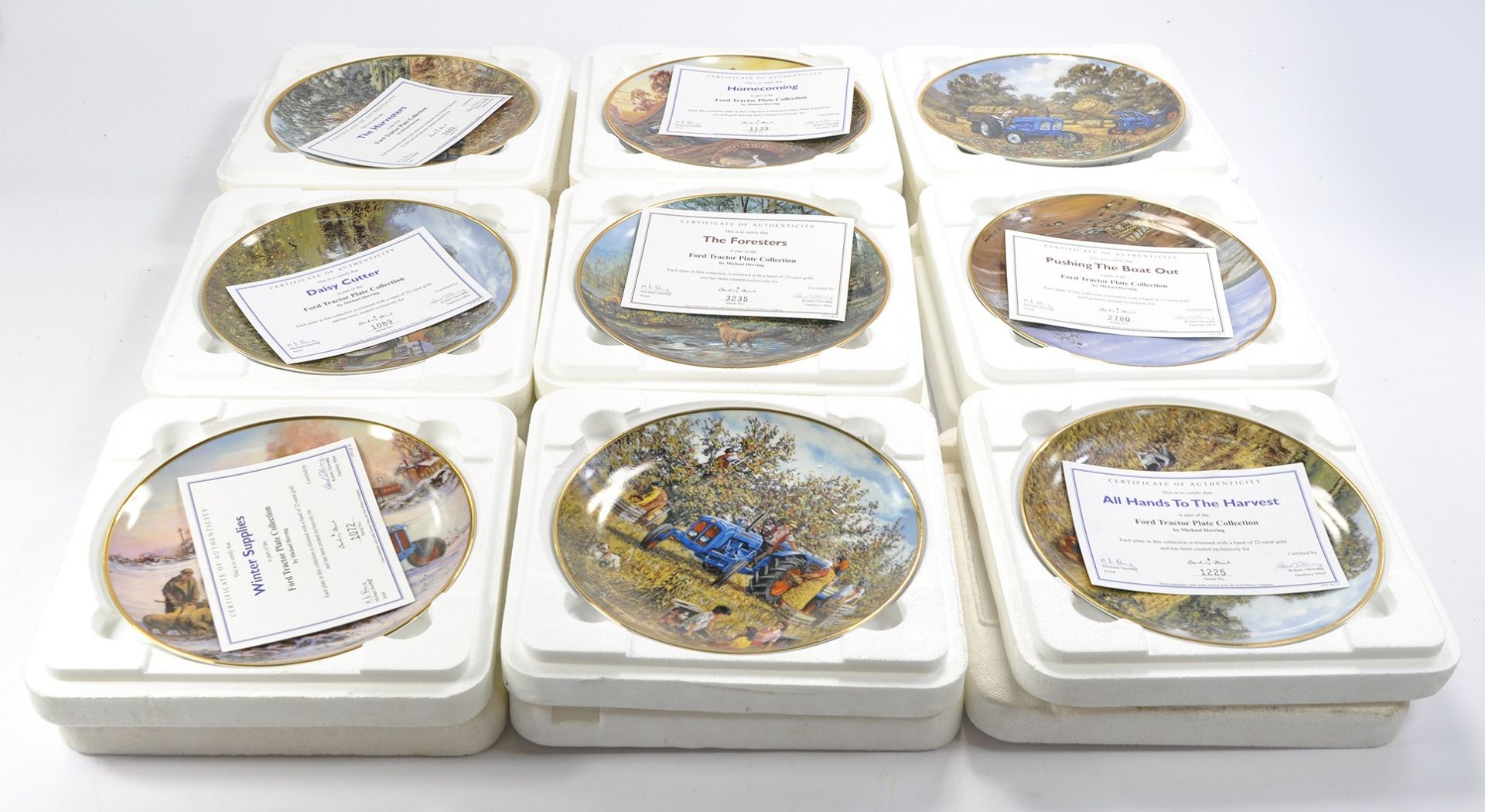 A group of Nine Danbury Mint Tractor themed plates. With certificates.