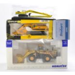 Universal Hobbies 1/50 Komatsu WA600 Wheel Loader (some UV fading and display wear) plus Atlas Eddie