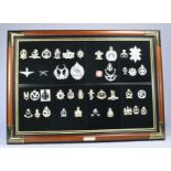 A further attractive framed display montage of military badges from the 'military badge collection'.