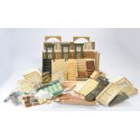 A various collection of Dolls House 1:12 Scale Miniature Building Materials comprising of doors,