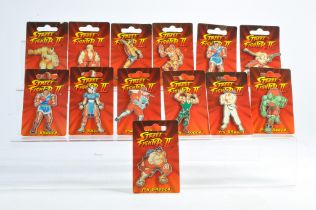 An assortment of Capcom Street Fighter II Pin Brooches. All unused.