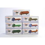 A group of seven Dan-Toy Guy Van diecast issues in various colour liveries as shown. All excellent