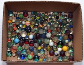 A vintage collection of marbles including some harder to find examples. Some larger sizes as shown.