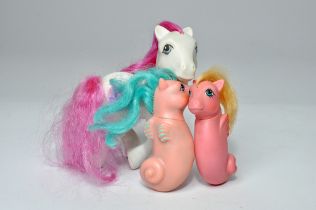 A group of three vintage (1980's) My Little Pony figures including duo of sea ponies and one other