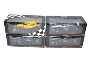 A group of four Minichamps 1/18 diecast F1 Racing cars comprising McLaren Collection trio plus