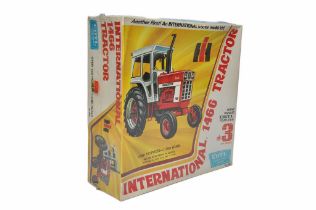 Ertl 1/25 plastic model kit comprising International 1466 Tractor. Sealed with wrapper.