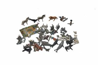 A group of worn lead metal figures including animals, accessories and others.