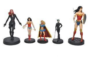 A group of female super-hero figures, comprising Wonder Woman, Super Woman etc.