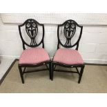 A collection of furniture comprising a pair of 19th Century shield back dining chairs with