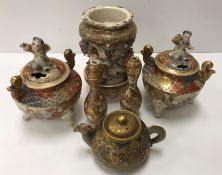 A collection of Satsuma wares to include a squat teapot of small proportions with figural