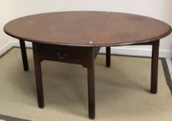 A 19th Century mahogany drop leaf dining table on square legs together with a 20th Century walnut