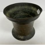 A 17th Century bronze mortar of plain form,