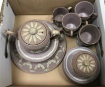 A Wedgwood Jasper ware part tea set with lilac ground comprising teapot, lidded sugar bowl,