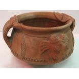 A 20th Century Indian terracotta two handled bowl with elephant head and foliate decoration 28 cm