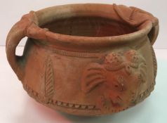 A 20th Century Indian terracotta two handled bowl with elephant head and foliate decoration 28 cm