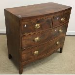 An early 19th Century figured mahogany and ebony strung bow fronted chest of two short over two
