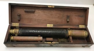 A mahogany cased brass two draw telescope 48 cm closed