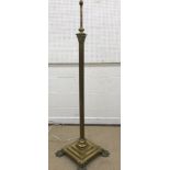 An early 20th Century brass Corinthian column standard lamp on a square stepped plinth base to