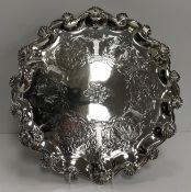 A Victorian silver salver in the Rococo taste with all-over engraved decoration of shells and
