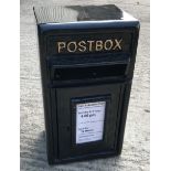 A modern reproduction postbox in black,