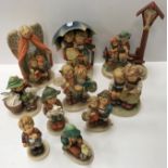 A collection of ten various Goebal Hummel figures including "Heavenly Protection", "Cheeky Fellow",