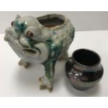 A 19th Century Chinese Shiwan Pottery green and cream slipped glazed pottery figure of "Jin Chan" a