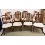 A set of eight Danish teak slat back dining chairs in the manner of Niels Koefoed,