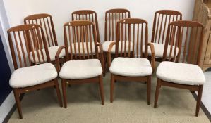 A set of eight Danish teak slat back dining chairs in the manner of Niels Koefoed,