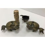 Two 19th Century Chinese bronze dog of Fo figures with hollow bases, possibly brush holders,