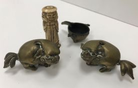 Two 19th Century Chinese bronze dog of Fo figures with hollow bases, possibly brush holders,