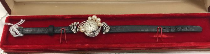 A Favre-Leuba 18 carat white gold diamond and pearl set ladies wristwatch,